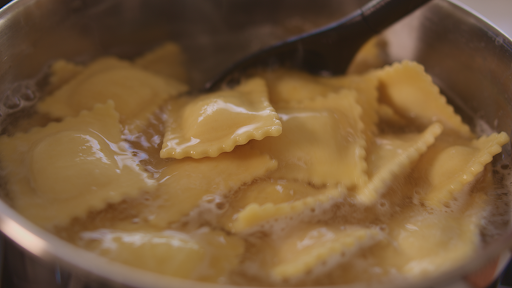 Cooking ravioli in boiling water.